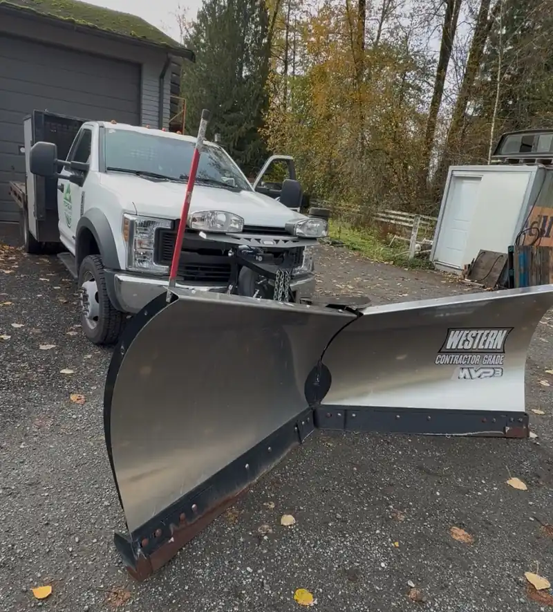 Top Gun Landscaping plow truck fitted with a Western contractor-grade V-plow